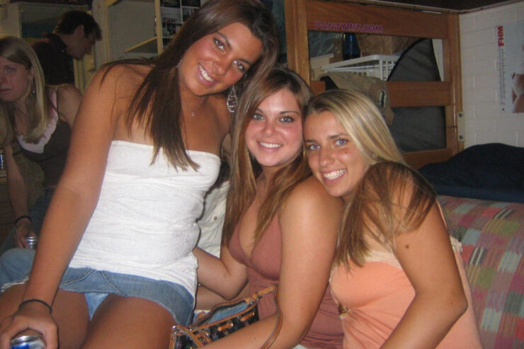 Group of girls sitting upskirt panty peek at a party