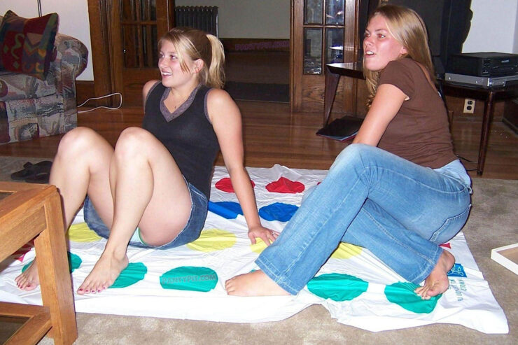 Thick blonde college girl playing Twister for a panty peek up her short denim skirt