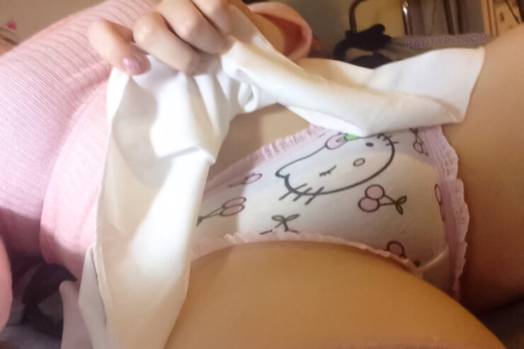 Amateur girl lifting her skirt to show her Hello Kitty panties